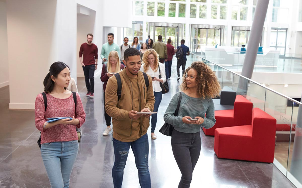 Students walk through a corridor at a university