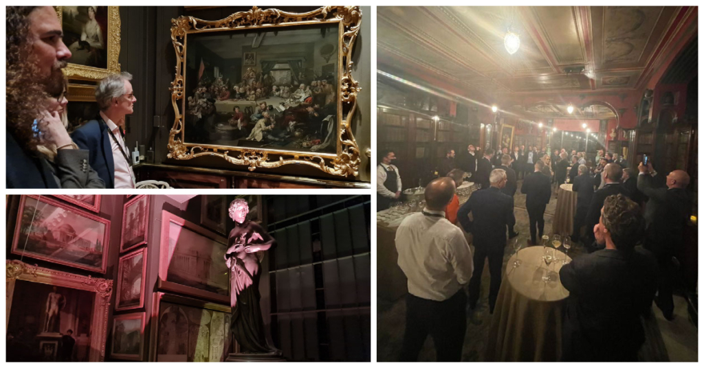 A professional networking event in a museum with classic oil paintings.