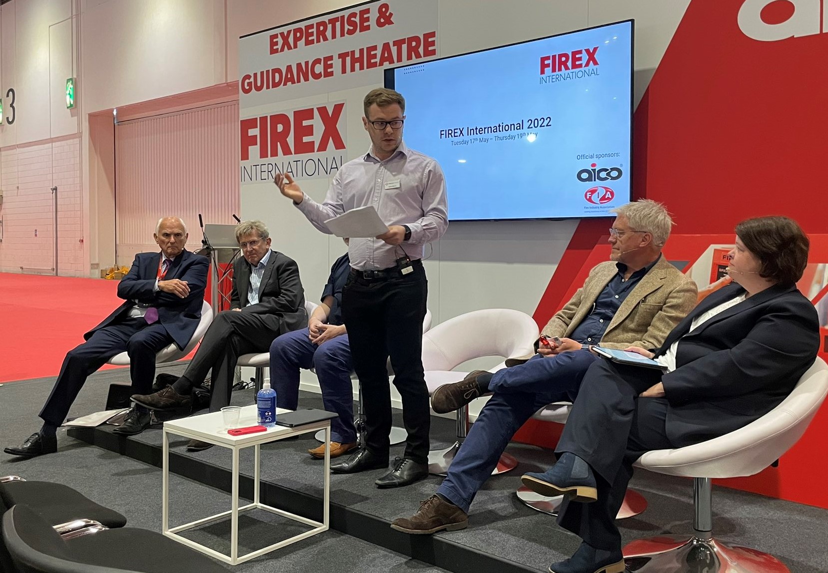 Panel of people ready to discuss a topic at the FIREX fire safety exhibition