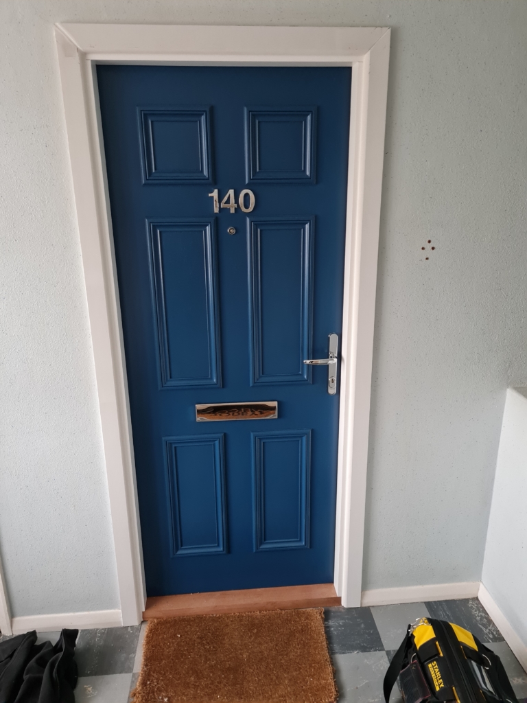 Blue front door made of fire resistant materials