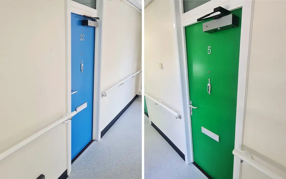 two fire doors in social housing flats with freedor door openers attached