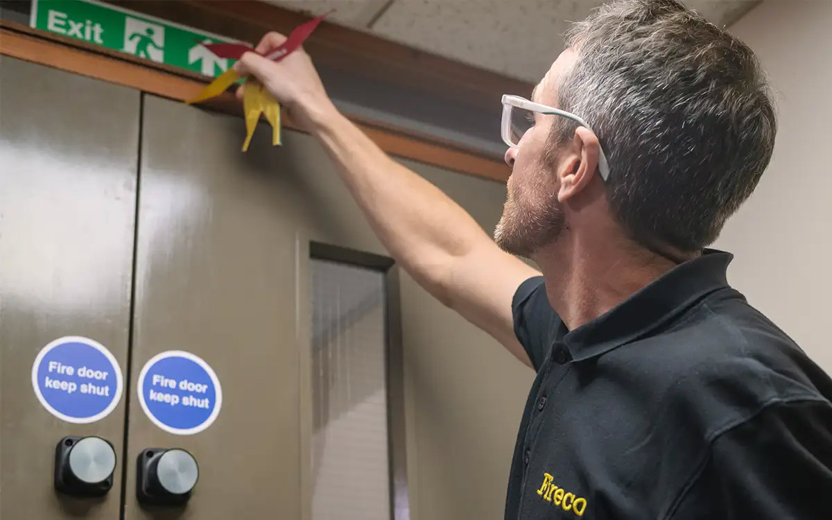 A Fireco door inspector inspects a school fire door