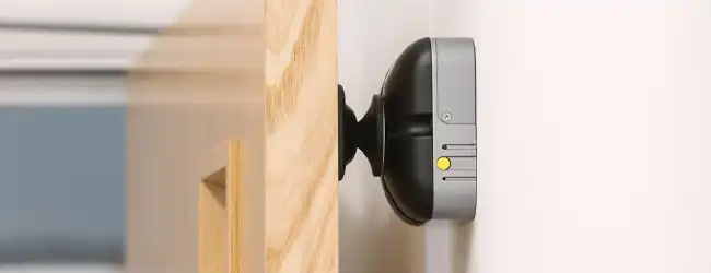 Radio activated devices DorMag fire door magnet holding a fire door open